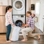 Couple working together on household chores and sharing the mental load in their relationship