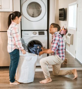 Couple working together on household chores and sharing the mental load in their relationship
