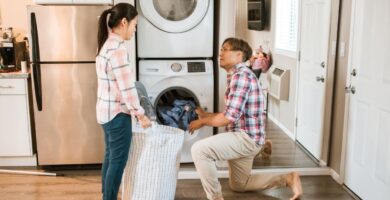 Couple working together on household chores and sharing the mental load in their relationship