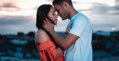 A loving couple embraces during a beautiful sunset outdoors, symbolizing romance and togetherness – navigating different love languages